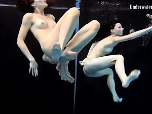 two women swim and get naked sexy