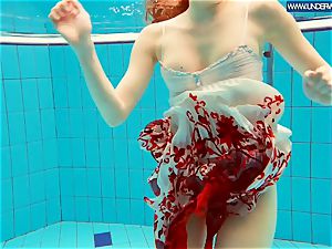 super hot polish red-haired swimming in the pool